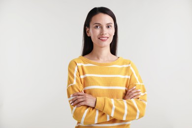 Photo of Portrait of beautiful woman on light background