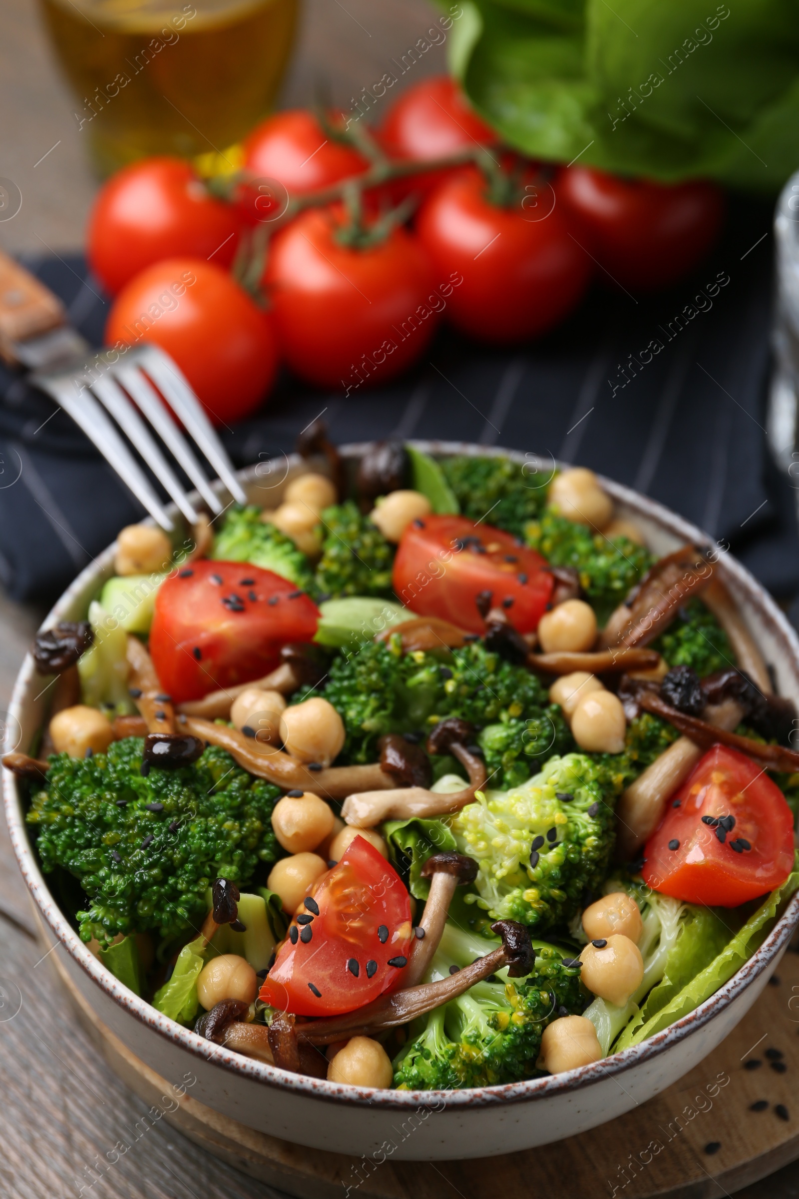 Photo of Delicious salad with shimeji mushrooms served on table, closeup
