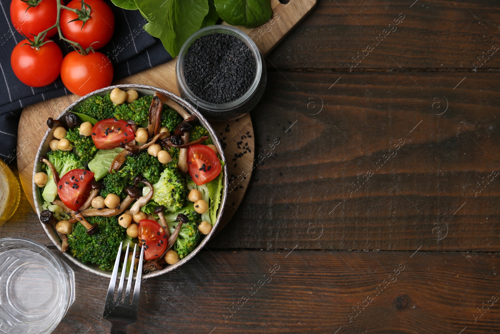 Delicious salad with shimeji mushrooms on wooden table, flat lay. Space for text Photo of Delicious salad with shimeji mushrooms on wooden table, flat lay. Space for text