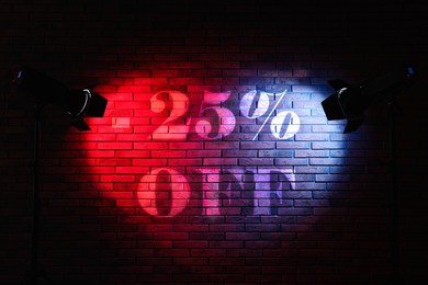 Image of 25 percent discount. Flyer design with light from spotlights on brick wall