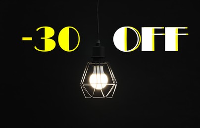 Image of 30 percent discount. Flyer design with glowing lamp in darkness