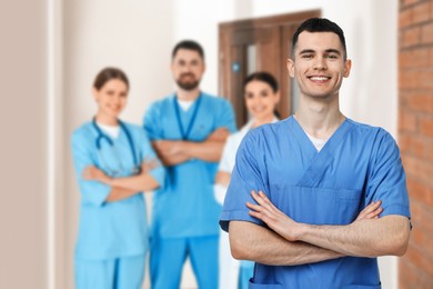 Image of Medical assistant and other healthcare workers in hospital, selective focus