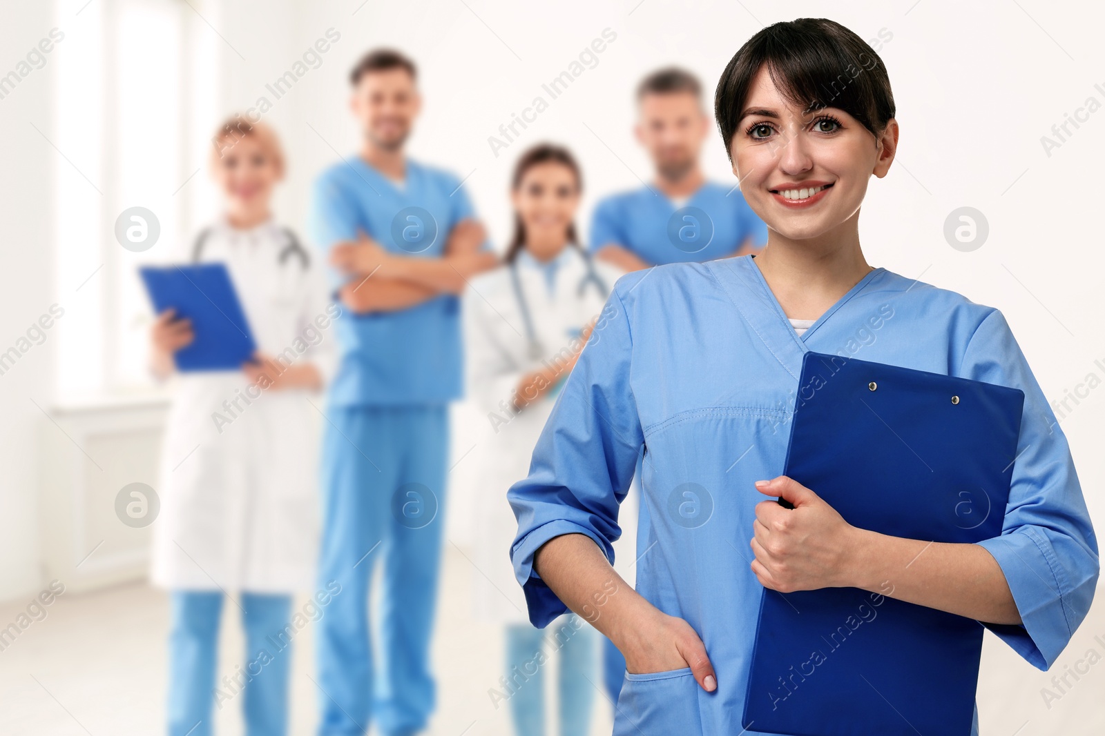Image of Medical assistant and other healthcare workers in hospital, selective focus