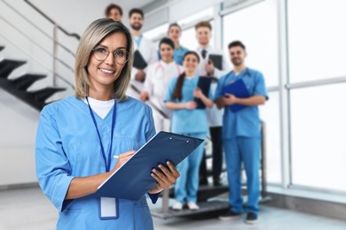 Image of Medical assistant and other healthcare workers in hospital, selective focus