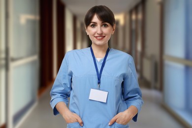 Image of Medical assistant in hospital hall. Healthcare worker