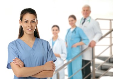 Image of Medical assistant and other healthcare workers in hospital, selective focus