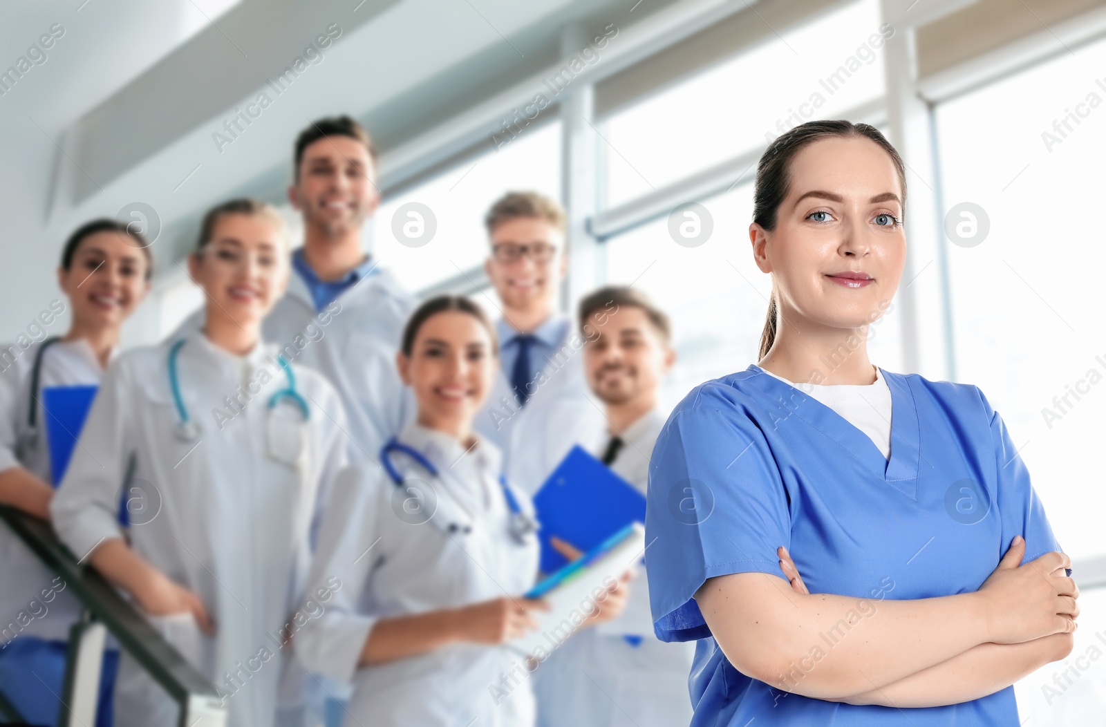 Image of Medical assistant and other healthcare workers in hospital, selective focus