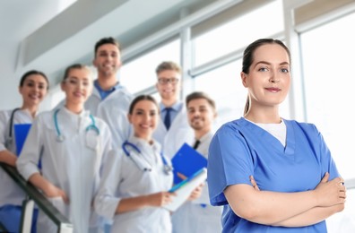 Image of Medical assistant and other healthcare workers in hospital, selective focus