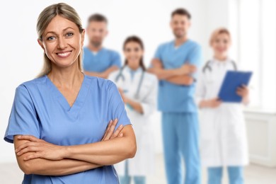 Image of Medical assistant and other healthcare workers in hospital, selective focus