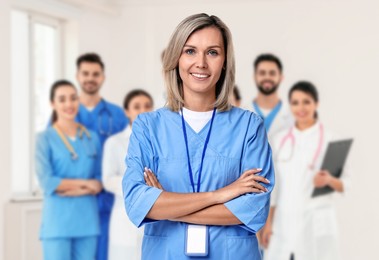 Image of Medical assistant and other healthcare workers in hospital, selective focus