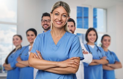 Image of Medical assistant and other healthcare workers in hospital, selective focus