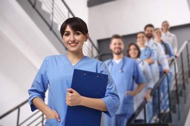 Image of Medical assistant and other healthcare workers in hospital, selective focus