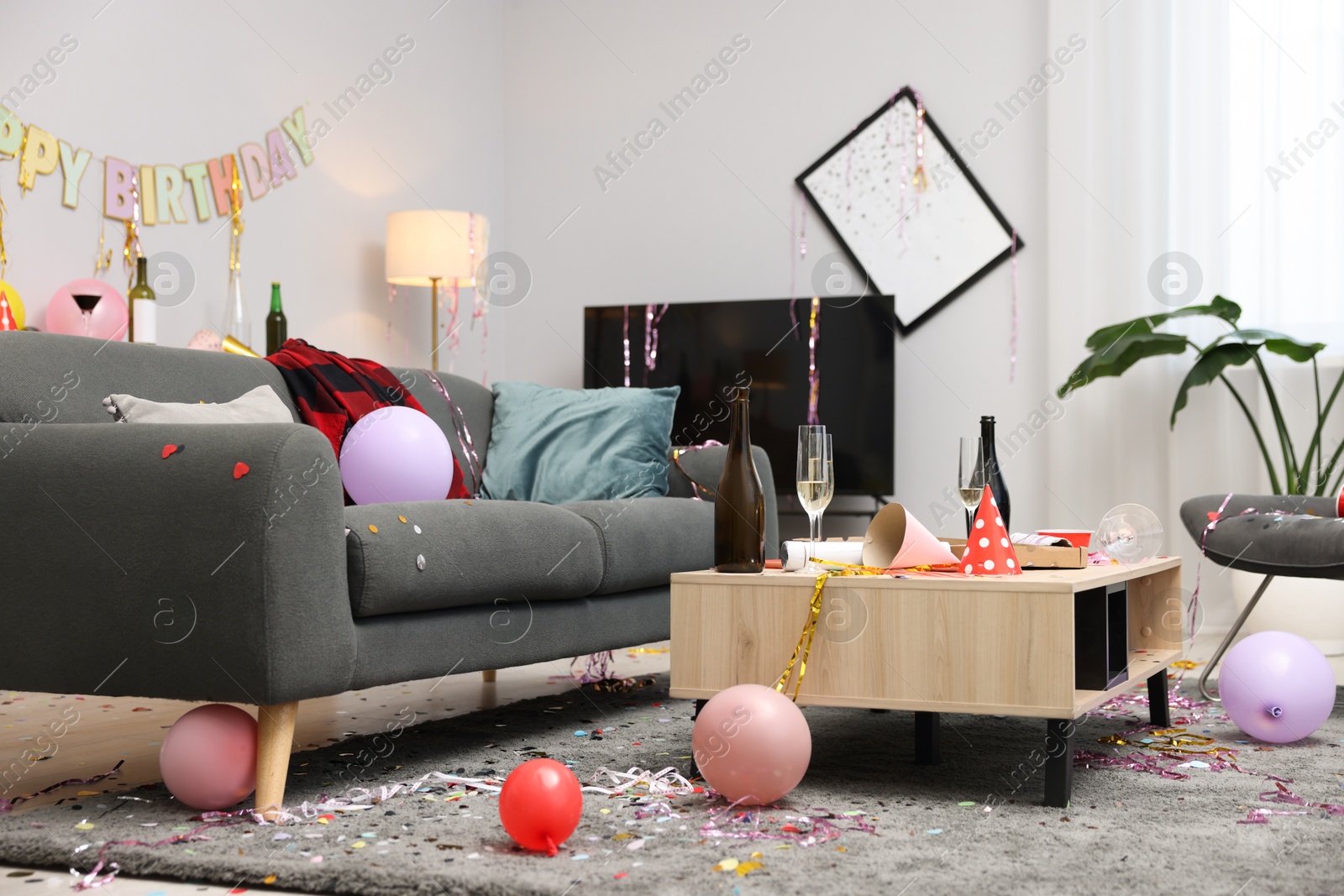 Mess in living room after birthday party Photo of Mess in living room after birthday party