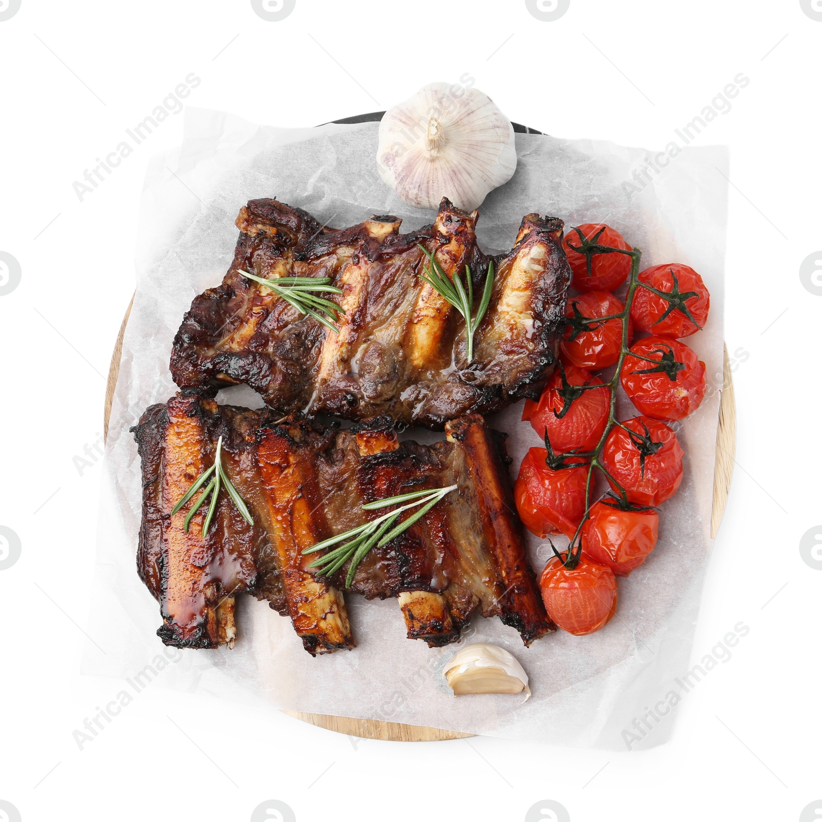 Photo of Roasted beef ribs with spices and tomatoes isolated on white, top view