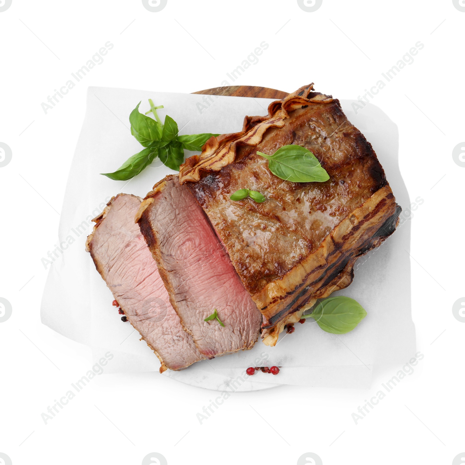 Photo of Delicious baked beef meat and spices isolated on white, top view
