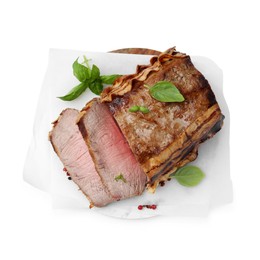 Photo of Delicious baked beef meat and spices isolated on white, top view