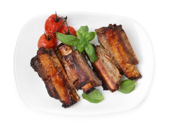Photo of Roasted beef ribs, tomatoes and basil isolated on white, top view
