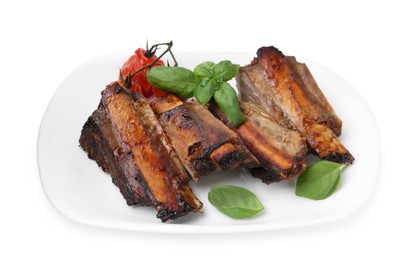 Photo of Roasted beef ribs, tomatoes and basil isolated on white