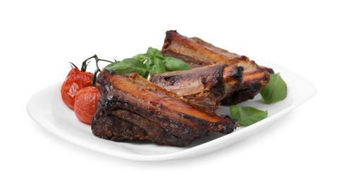 Photo of Roasted beef ribs, tomatoes and basil isolated on white