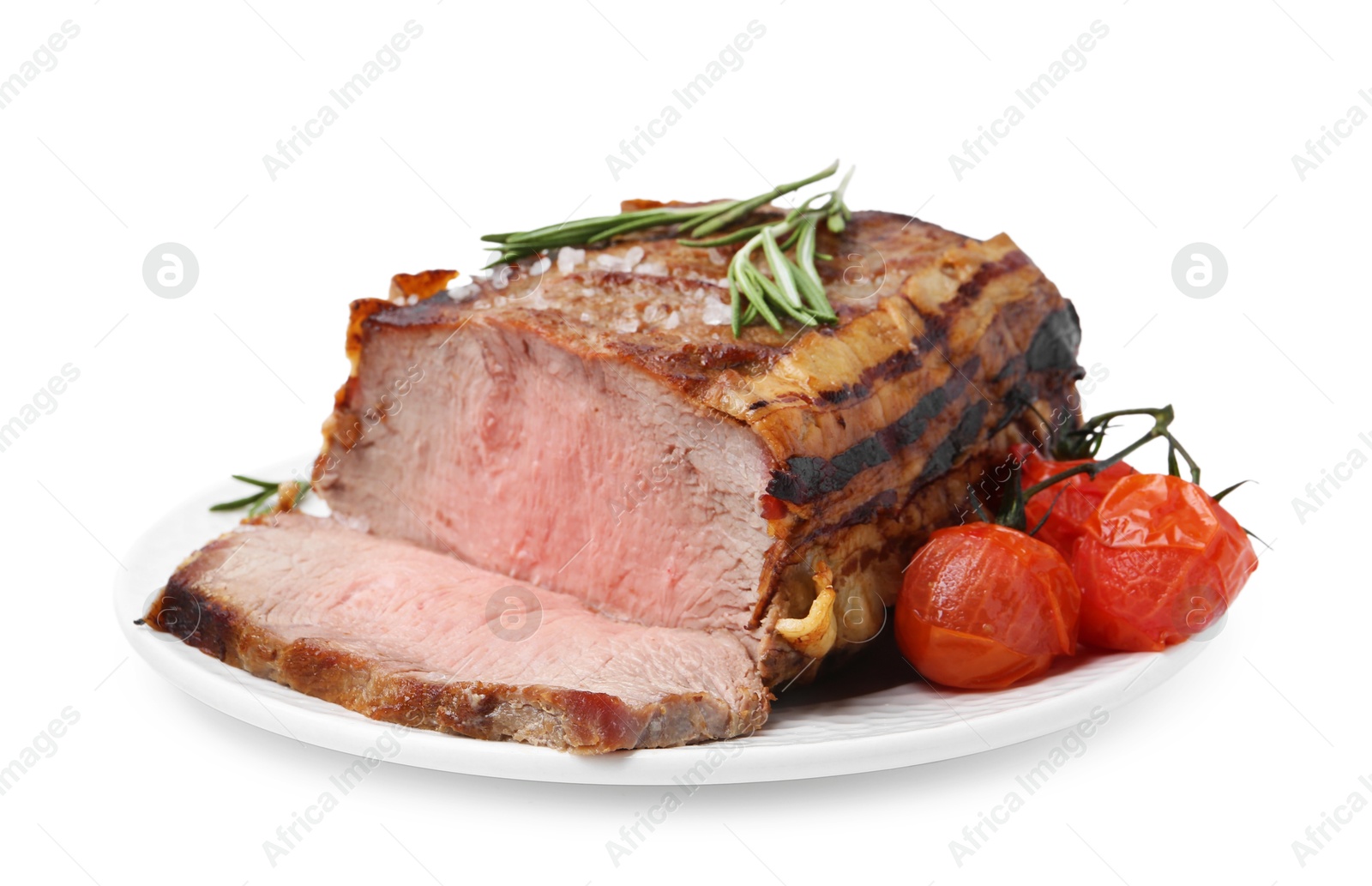Delicious baked beef meat, tomatoes, rosemary and salt isolated on white Photo of Delicious baked beef meat, tomatoes, rosemary and salt isolated on white