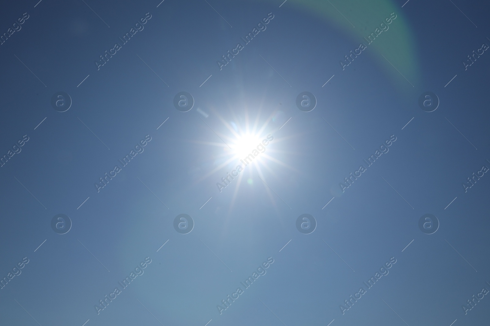 Photo of Beautiful blue sky on sunny day, bottom view
