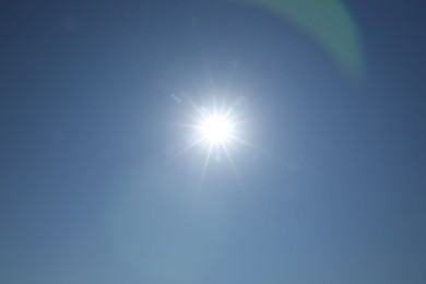 Photo of Beautiful blue sky on sunny day, bottom view
