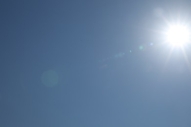 Photo of Beautiful blue sky on sunny day, bottom view