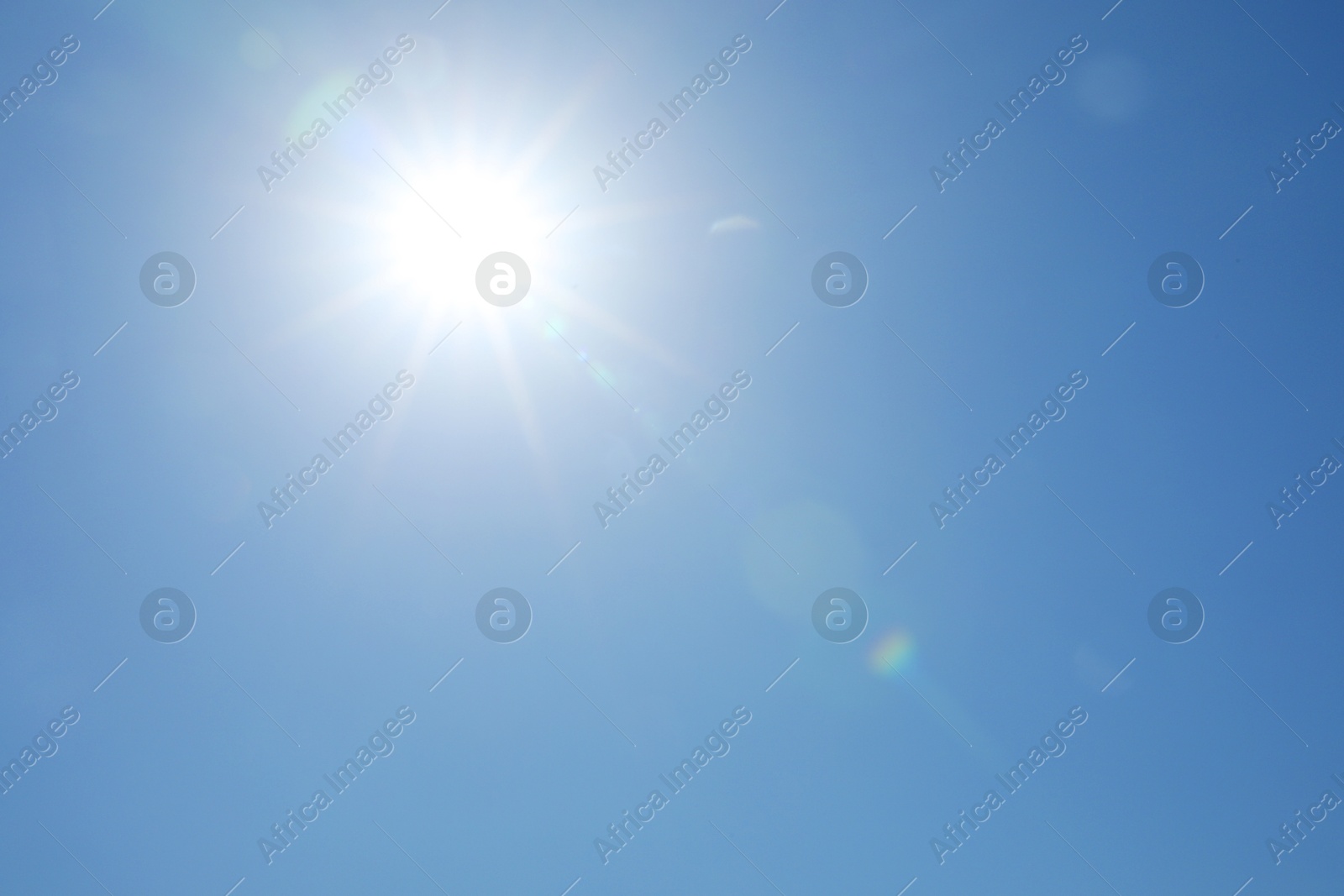 Photo of Beautiful blue sky on sunny day, bottom view