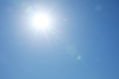 Photo of Beautiful blue sky on sunny day, bottom view