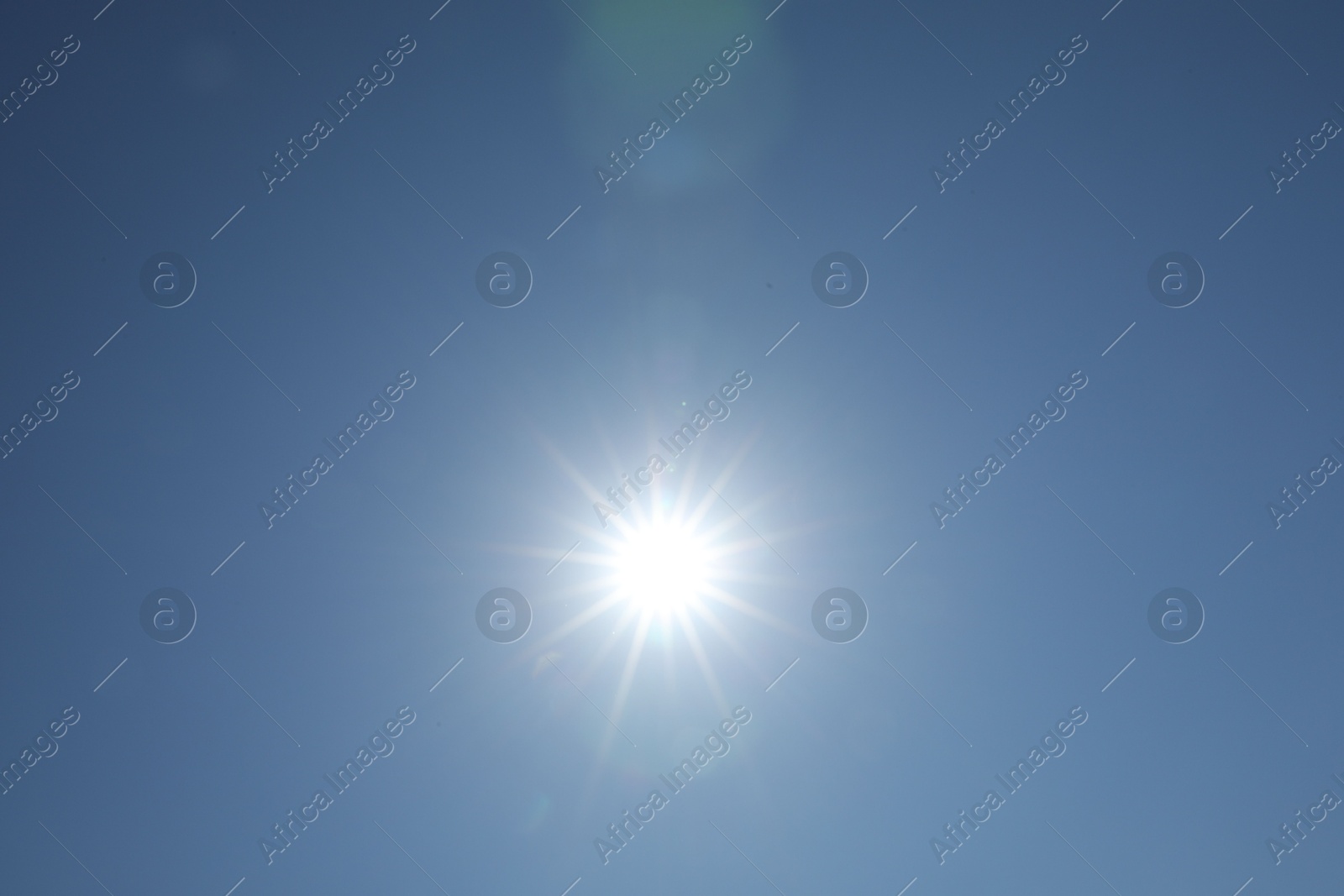 Photo of Beautiful blue sky on sunny day, bottom view