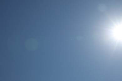 Photo of Beautiful blue sky on sunny day, bottom view