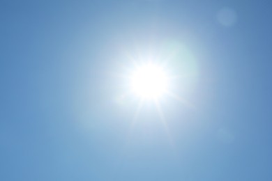 Photo of Beautiful blue sky on sunny day, bottom view