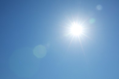 Photo of Beautiful blue sky on sunny day, bottom view