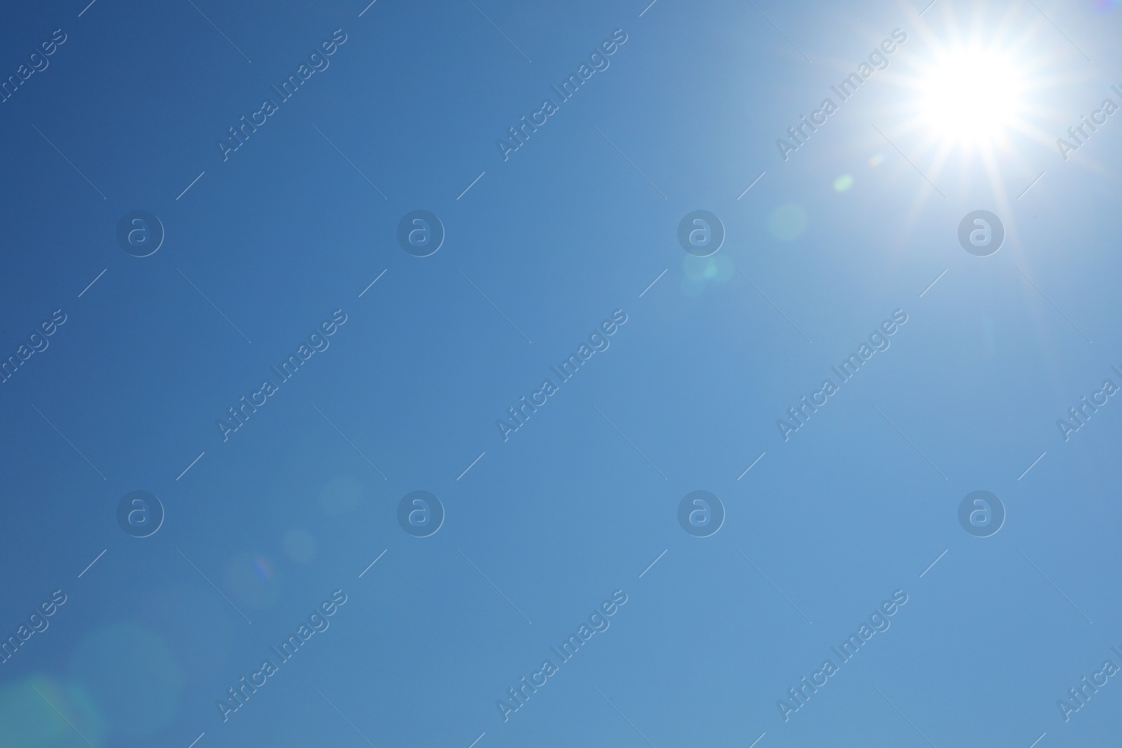 Photo of Beautiful blue sky on sunny day, bottom view