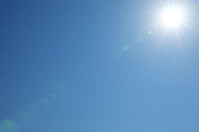 Photo of Beautiful blue sky on sunny day, bottom view