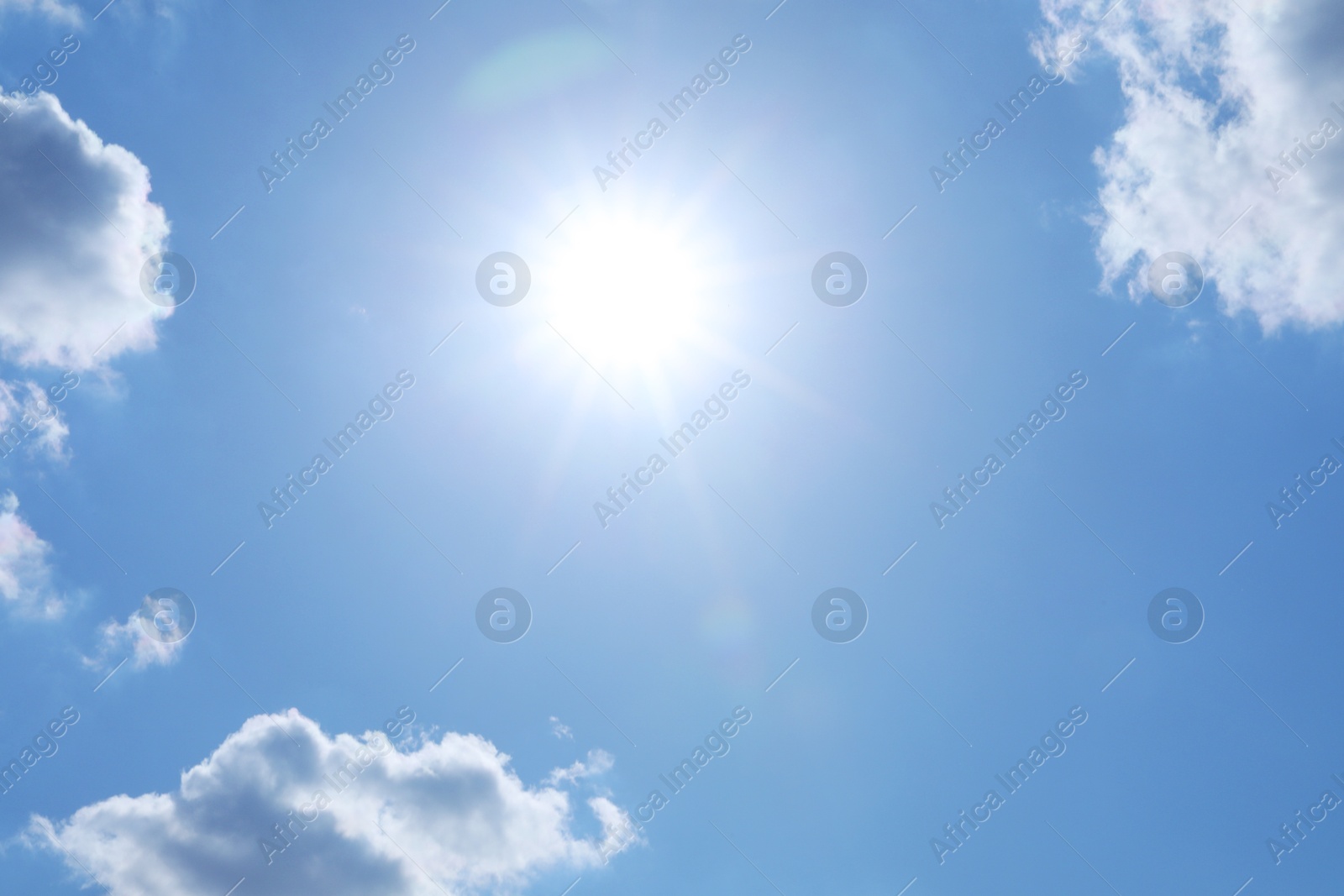 Photo of Beautiful blue sky with clouds on sunny day, bottom view