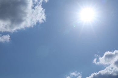 Photo of Beautiful blue sky with clouds on sunny day, bottom view