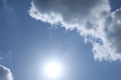 Photo of Beautiful blue sky with clouds on sunny day, bottom view
