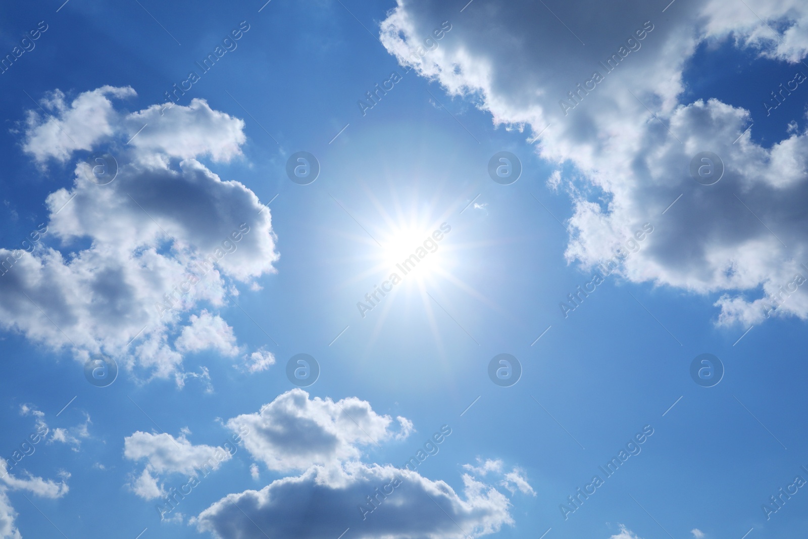 Photo of Beautiful blue sky with clouds on sunny day, bottom view