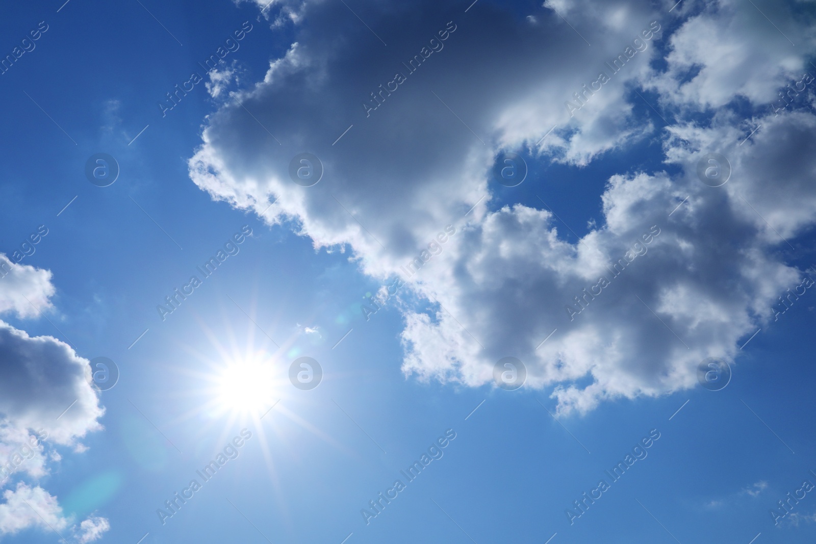 Photo of Beautiful blue sky with clouds on sunny day, bottom view