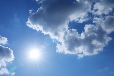Photo of Beautiful blue sky with clouds on sunny day, bottom view