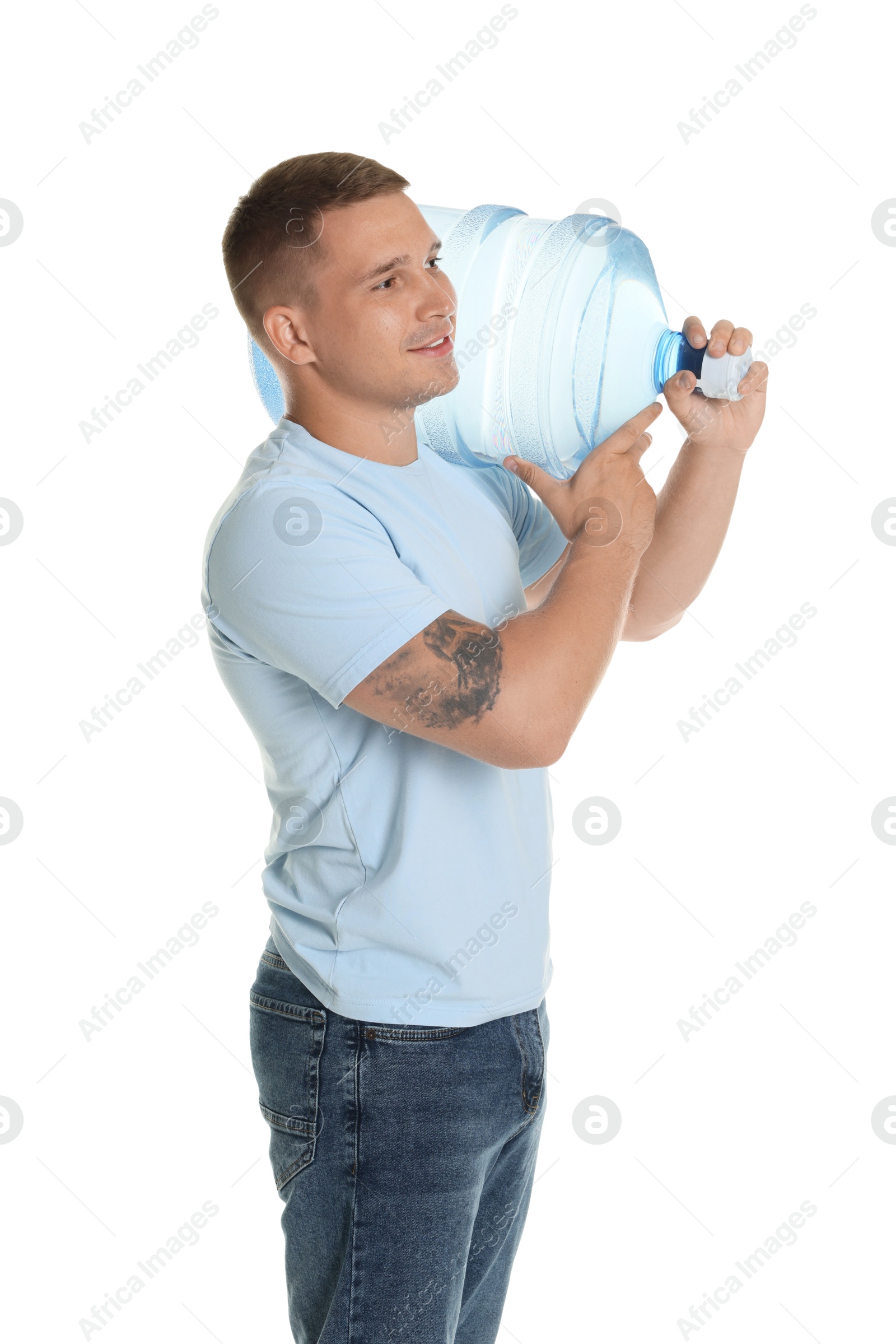 Photo of Smiling delivery man with cooler bottle of water on white background