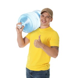 Photo of Smiling delivery man with cooler bottle of water showing thumbs up on white background