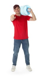 Photo of Smiling delivery man with cooler bottle of water pointing at camera on white background