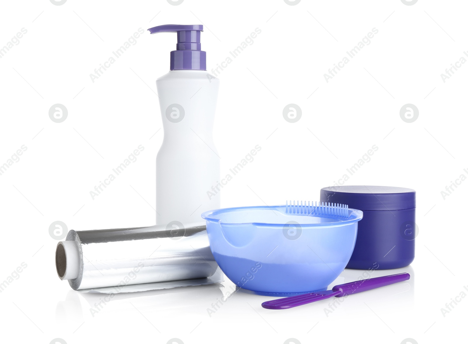 Care cosmetic products for blonde hair, powder, spatula and roll of aluminium foil isolated on white Photo of Care cosmetic products for blonde hair, powder, spatula and roll of aluminium foil isolated on white