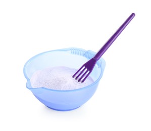 Photo of Care cosmetic product for blonde hair. Powder in bowl and spatula isolated on white