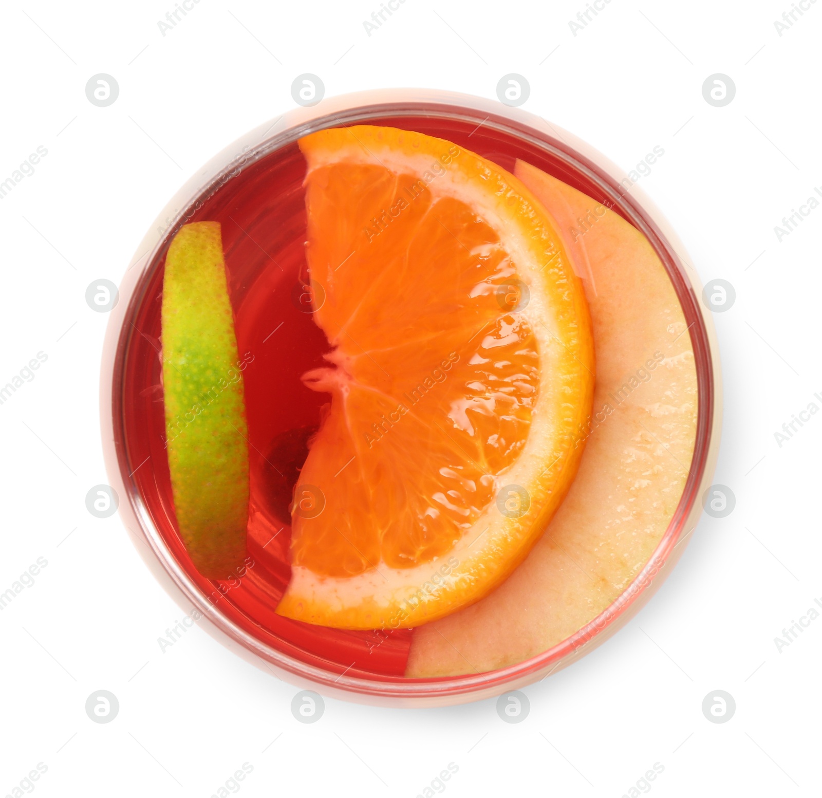 Tasty punch with slices of fruits in glass isolated on white, top view. Refreshing drink Photo of Tasty punch with slices of fruits in glass isolated on white, top view. Refreshing drink