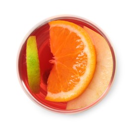 Photo of Tasty punch with slices of fruits in glass isolated on white, top view. Refreshing drink