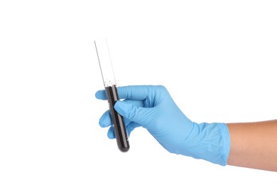 Photo of Scientist holding test tube with soil sample on white background, closeup