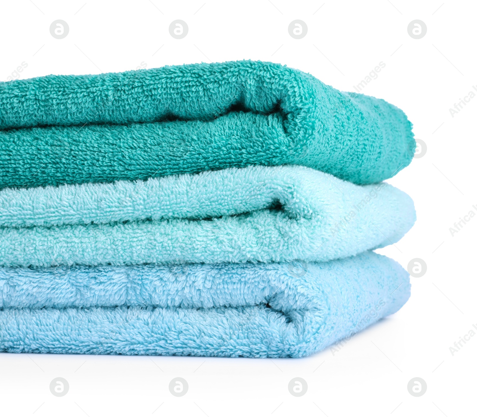 Photo of Stack of colorful terry towels isolated on white